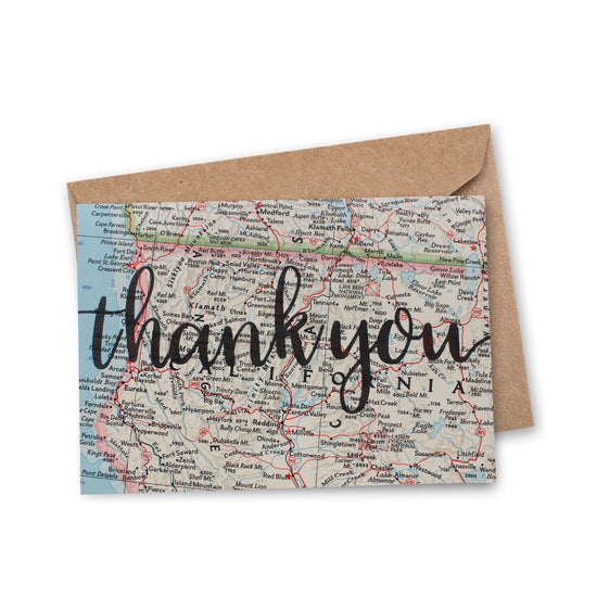 thank you in script font printed on recycled vintage map